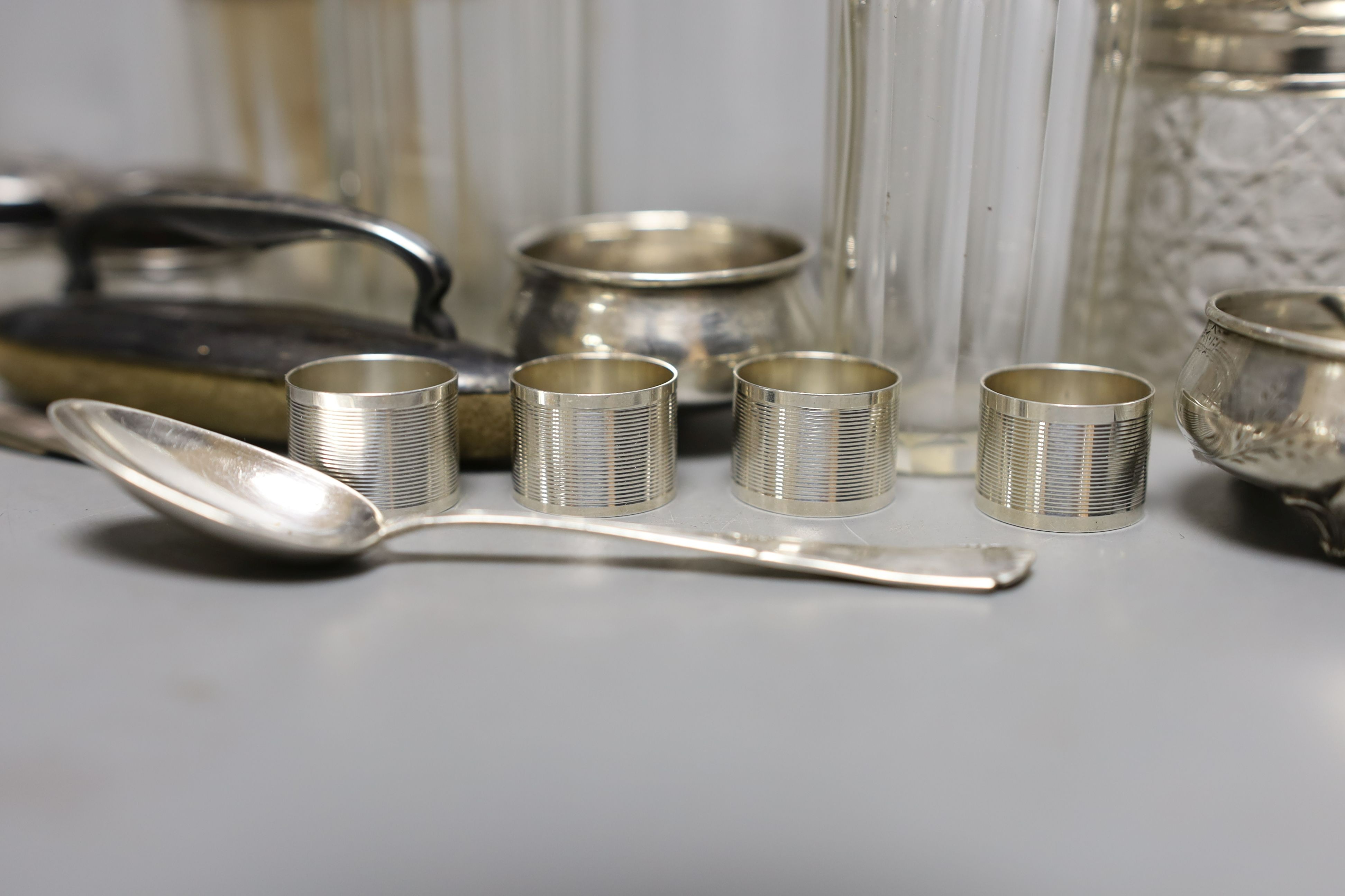 Eleven assorted silver topped glass toilet jars, a pair of 800 salts and eight other items.